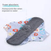 Reusable absorbent sanitary cloth pads in light blue and floral patterns