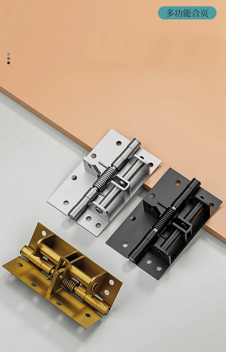 A set of automatic self-closing door hinges in brass and black finishes displayed on a light surface.