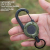 A hand holds a heavy duty retractable pull badge holder keychain with a green and black design.