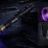 A compact professional grade multi-spectrum UV flashlight is shown illuminating a circuit board and a ruler.
