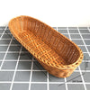 A natural rattan woven serving basket shown in profile with dimensions marked.