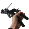 A hand holds a black stainless steel cable tie cutting tool with a wire cutter tip.