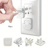 White outlet covers for baby proofing shown being installed into a wall electrical outlet.