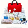 A red first aid kit box filled with various medical supplies including bandages, wipes, and tools.