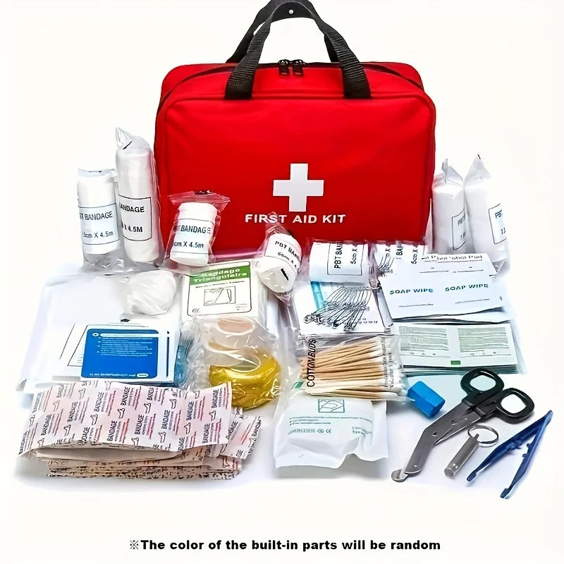 A red first aid kit box filled with various medical supplies including bandages, wipes, and tools.