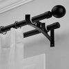 Black double curtain rod brackets for wall mounting hardware.