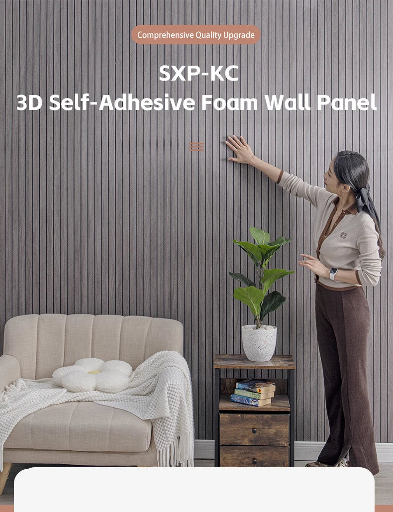 A woman is applying a 3D self-adhesive foam wall panel to a gray textured wall, demonstrating the product's installation.