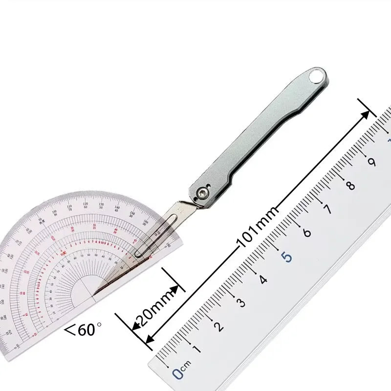 A mini folding art knife with a metal blade and a scale showing measurements.