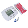A white digital thermostat with a display and buttons, along with installation screws and a wrench.