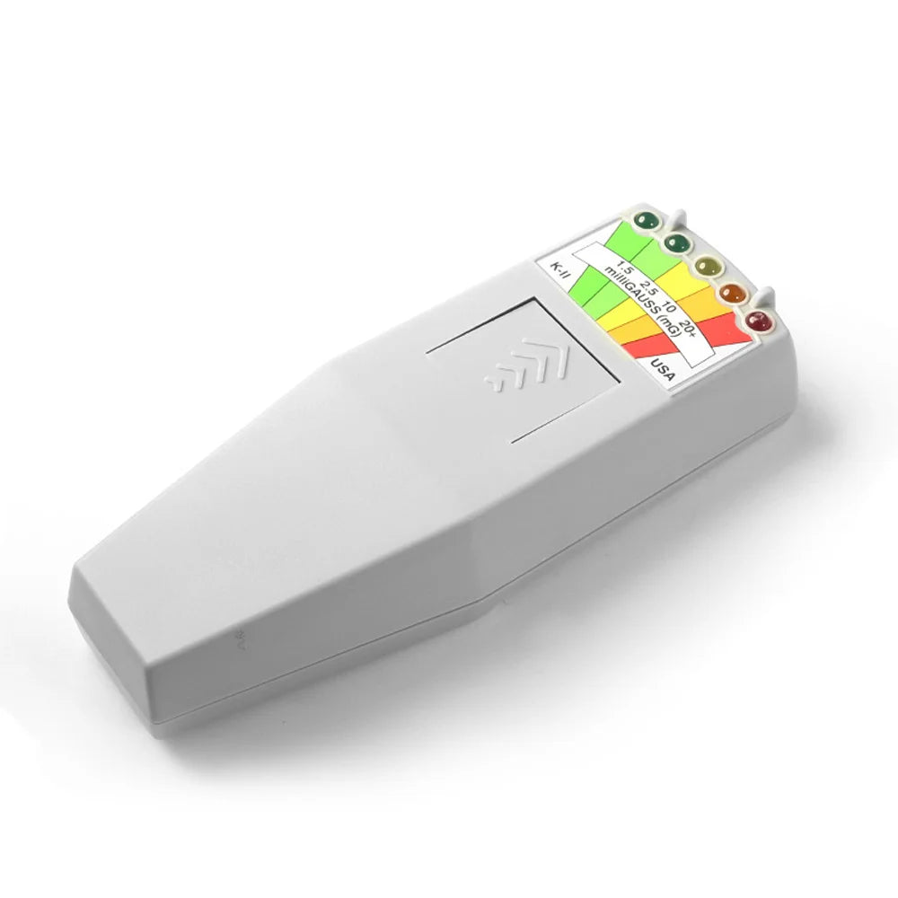 A white portable EMF radiation detector device with multiple indicator lights and a USA marking.