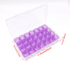 A clear plastic organizer kit for diamond painting tools, holding numerous small, translucent purple containers.