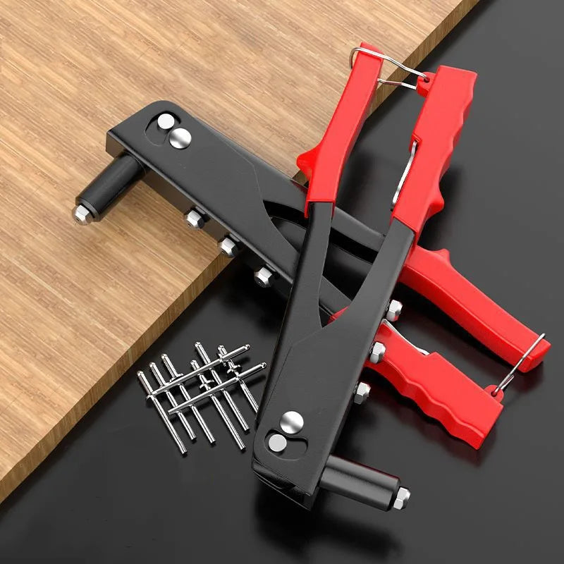 A set of heavy duty hand rivet gun kits featuring red and black metal tools on a wooden surface.