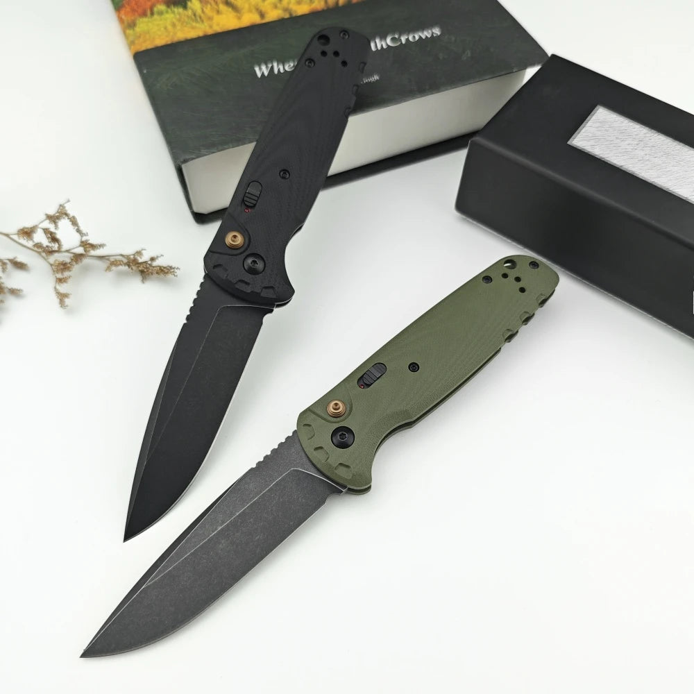 A folding utility knife with a black blade and a green G10 handle is displayed next to its packaging box.