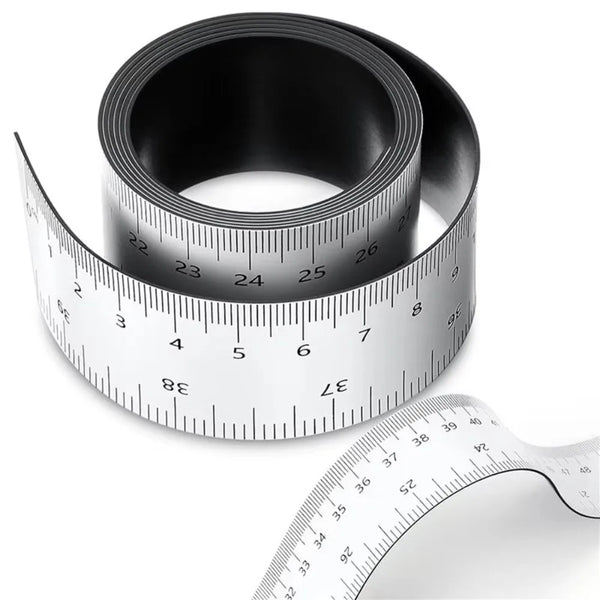 A black magnetic dual scale flexible measuring ruler is shown with a white ruler in the foreground.