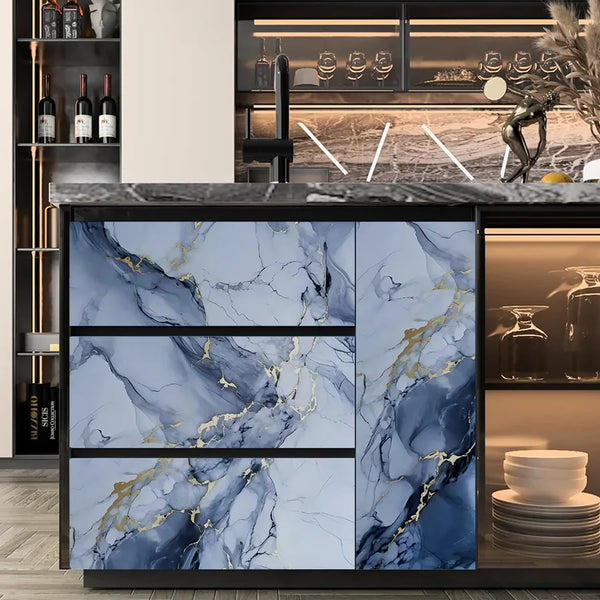 A kitchen cabinet door featuring blue and gray marble pattern with gold veining.