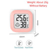 A pink compact digital thermometer and hygrometer displaying 25.6°C and 38% humidity.