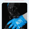 A close-up of a hand wearing blue latex coated work gloves being used in a wet environment.