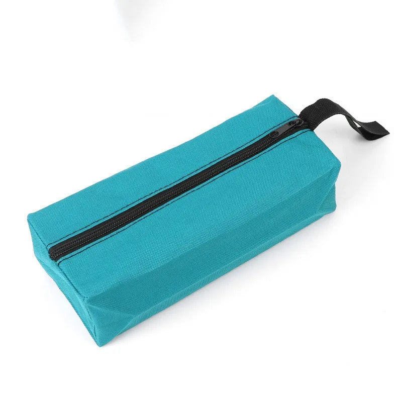 A teal Oxford cloth hand-held storage bag with a black zipper and strap.