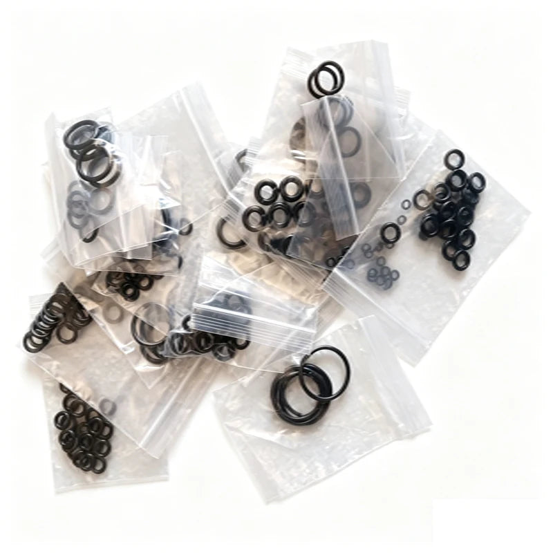 A collection of black O-rings packaged in clear plastic bags for automotive and mechanical use.