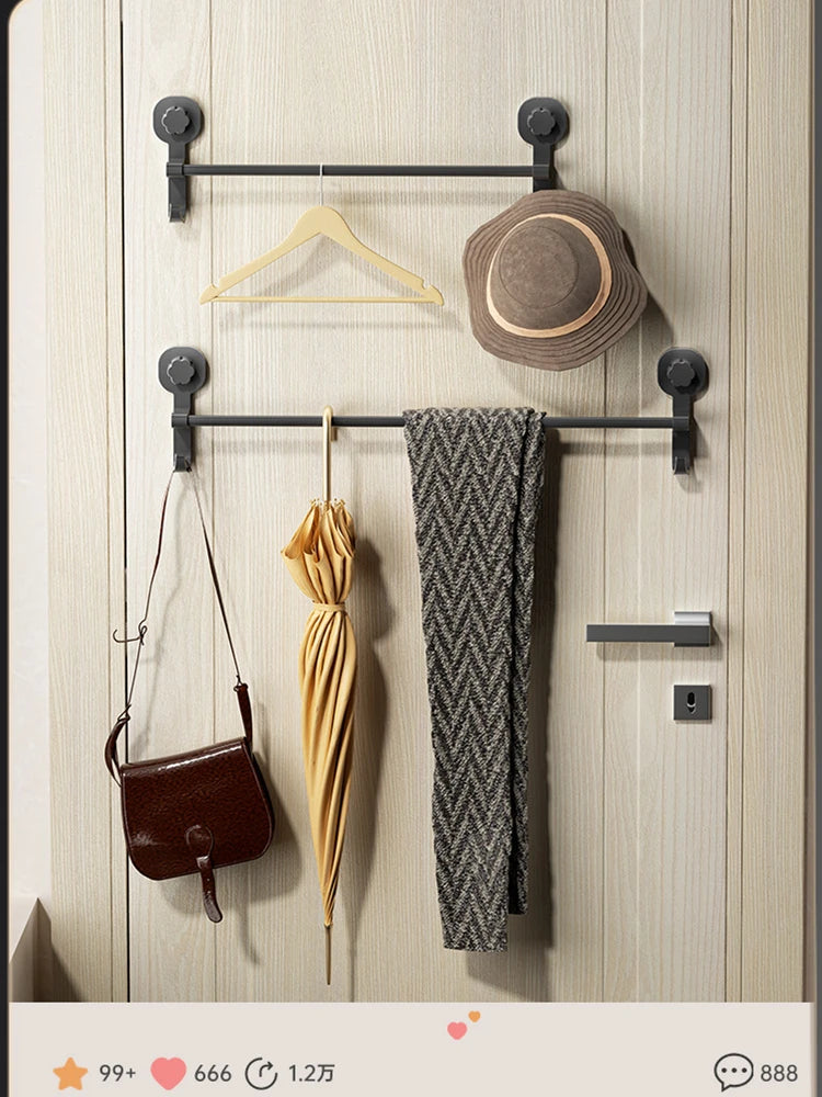 A wooden towel rack with a black metal bar holds a brown hat and a gray towel, alongside a brown leather purse.