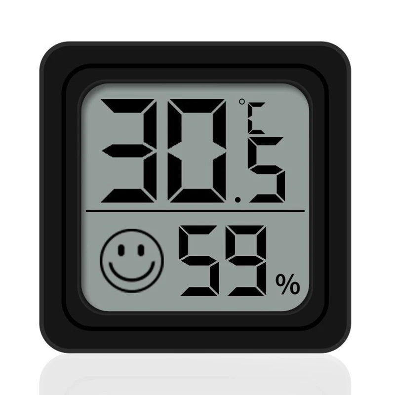 Termómetro y higrómetro digital negro mostrando 30.5 grados y 59 por ciento de humedad.