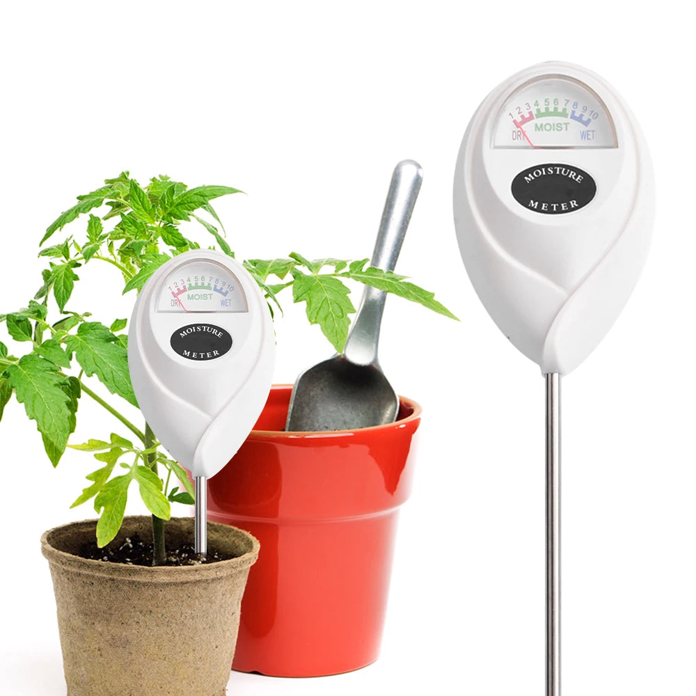 A white digital soil moisture meter with a probe is shown next to a potted plant and a red pot.