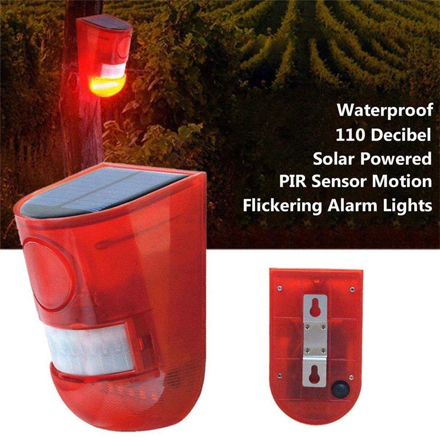 A red solar powered PIR motion sensor flickering alarm light device.