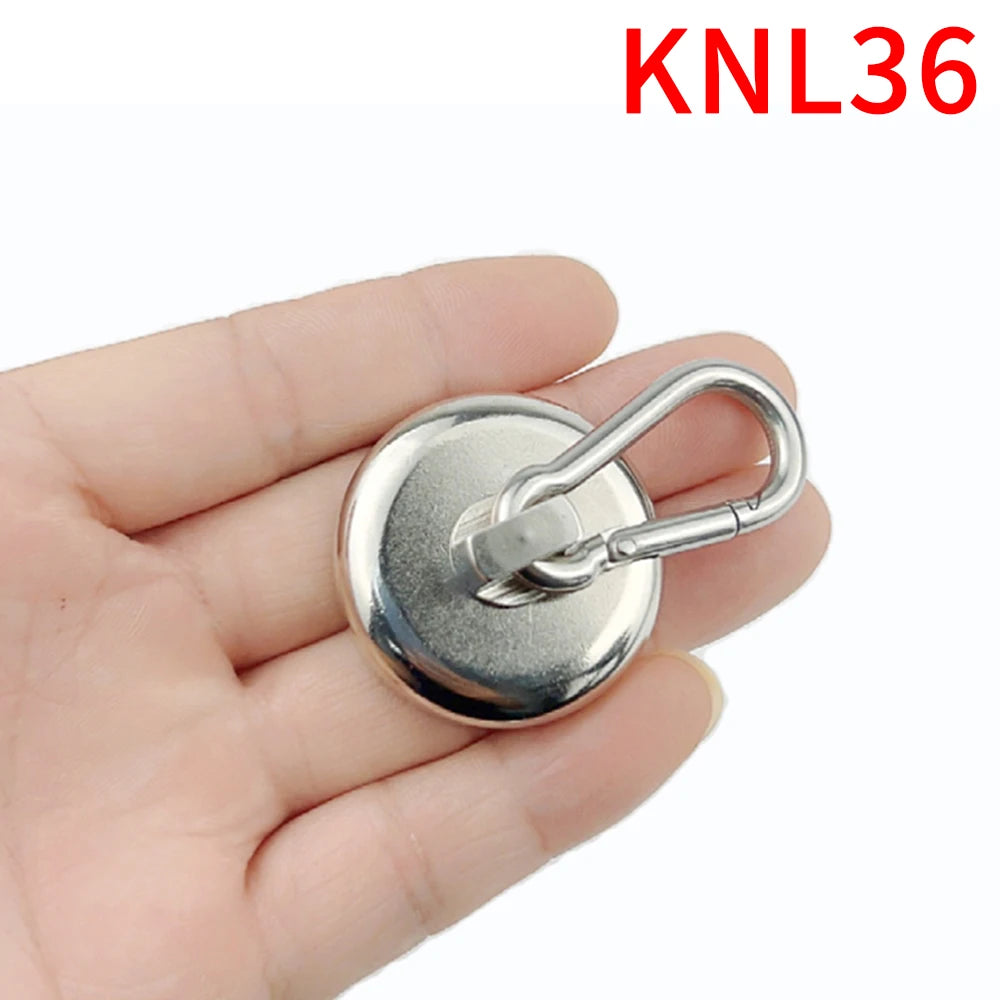 A hand holds a silver heavy duty magnetic hook with a swivel carabiner attached.