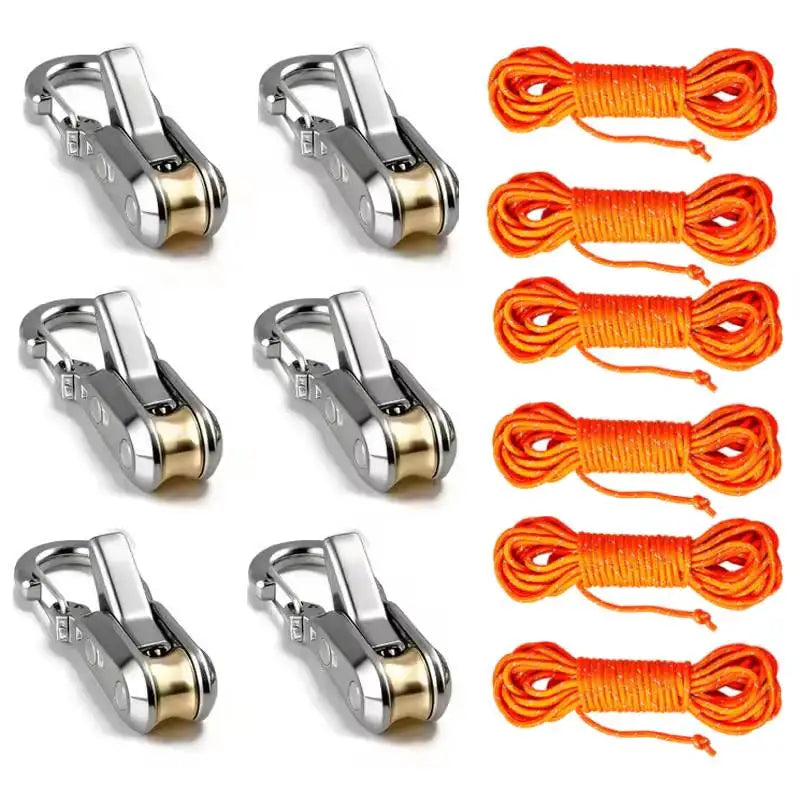 A set of adjustable aluminum tent rope tensioners and orange cord for securing ropes.