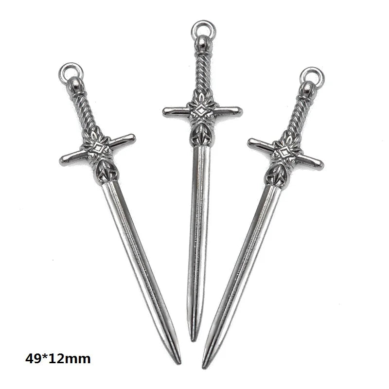 A pair of silver-toned, multi-style alloy charms resembling swords or daggers.
