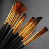 A set of twelve black brush handles with golden ferrules and brown bristles for painting.