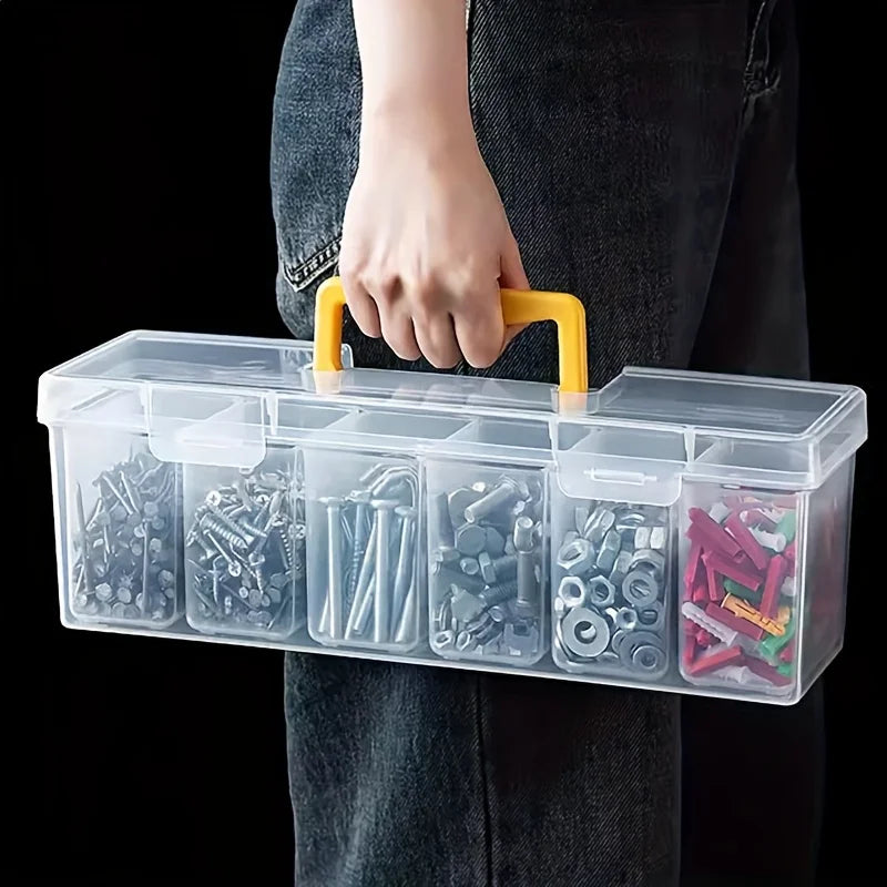 A hand holds a clear, multi-compartment plastic storage box filled with various small tools and hardware.