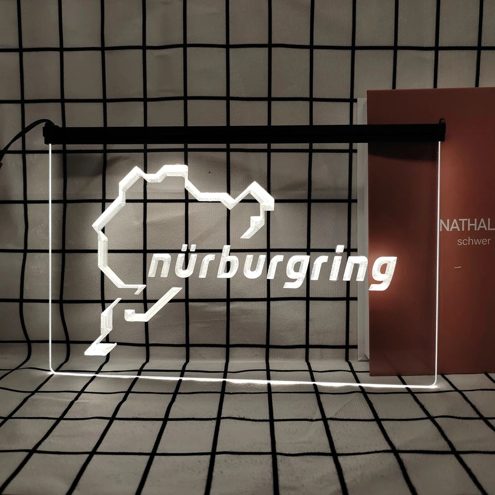A white neon sign shaped like the map of Nuremberg is displayed in a grid pattern against a dark background.