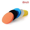 A set of five compound buffing polishing pads in various colors including orange, black, blue, white, and yellow.