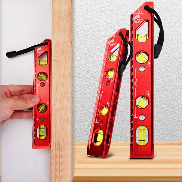 A red magnetic level ruler with yellow markers is shown next to a wooden plank.