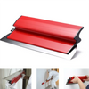 A professional red and silver skimming blade used for drywall finishing.