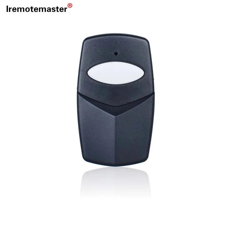 A black garage door remote transmitter with a white lens and a textured body.