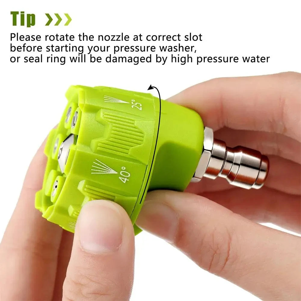 A hand is rotating a green pressure washer nozzle with adjustable settings before using it.