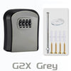 Grey wall-mounted security key lock box with a vertical key slot and multiple keyholes.