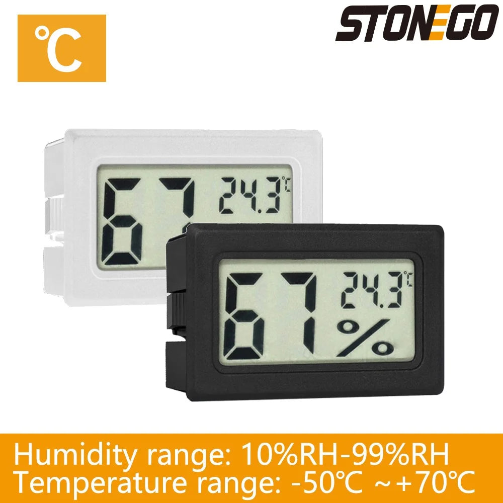 A white and black digital LCD thermometer and hygrometer displaying 67 degrees and 24.3 degrees Celsius