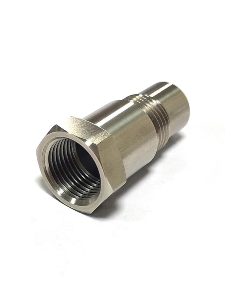 A metallic precision oxygen sensor adapter with a threaded connection and a hexagonal opening.