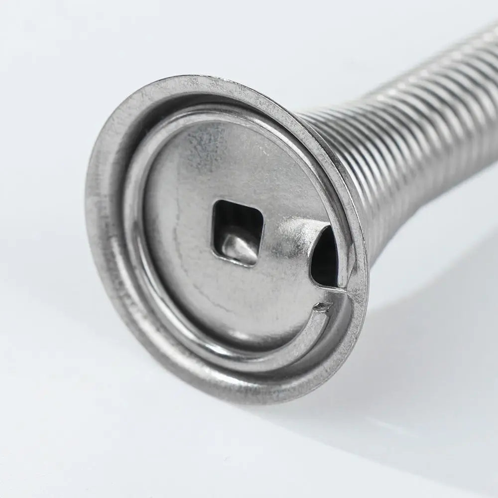 A close-up view of a silver decorative iron spring door stopper with a threaded shaft and a square opening.