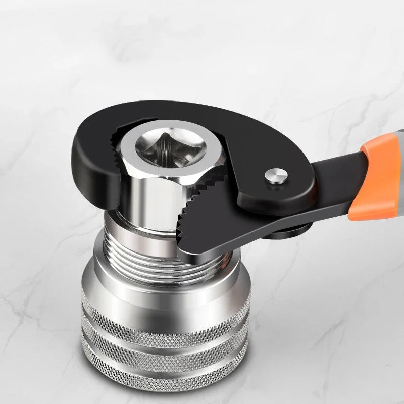 A close-up view of an adjustable universal socket wrench with a black handle and silver metal body.