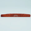 A wooden guitar bone bridge saddle labeled Guyker ATR-7439