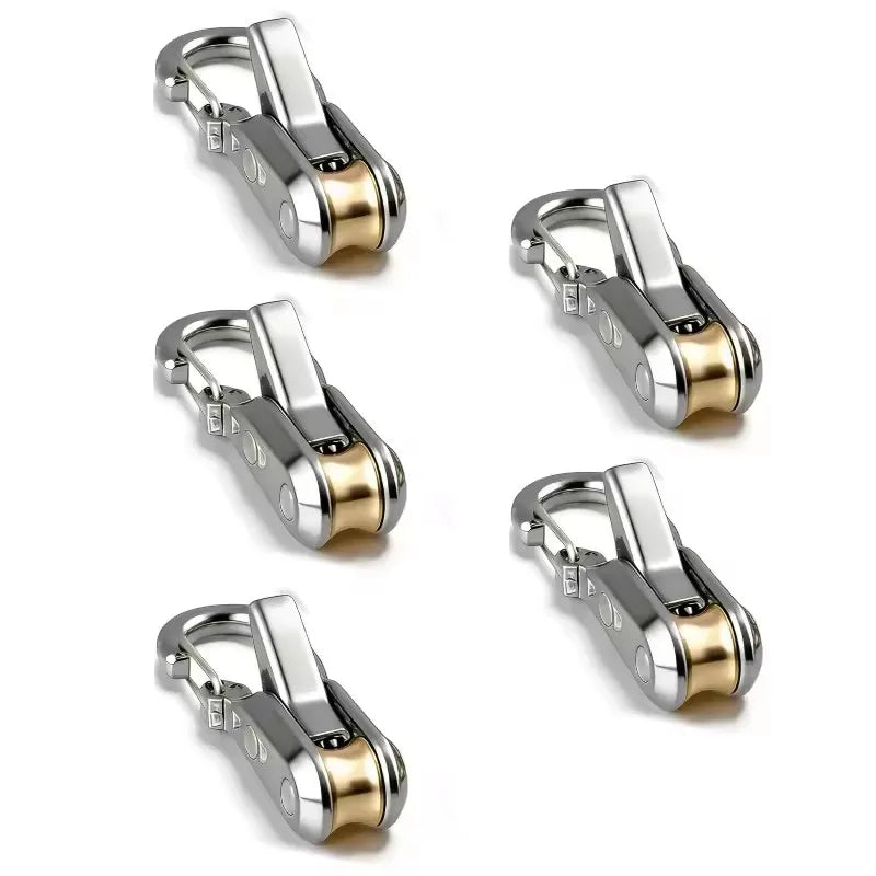 A set of four adjustable aluminum tent rope tensioners with gold-toned accents.
