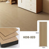 Light brown wood grain floor tiles installed on a wooden floor, showing tile dimensions and texture.