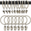 A set of metal curtain rings and clips hanging from a black rod.