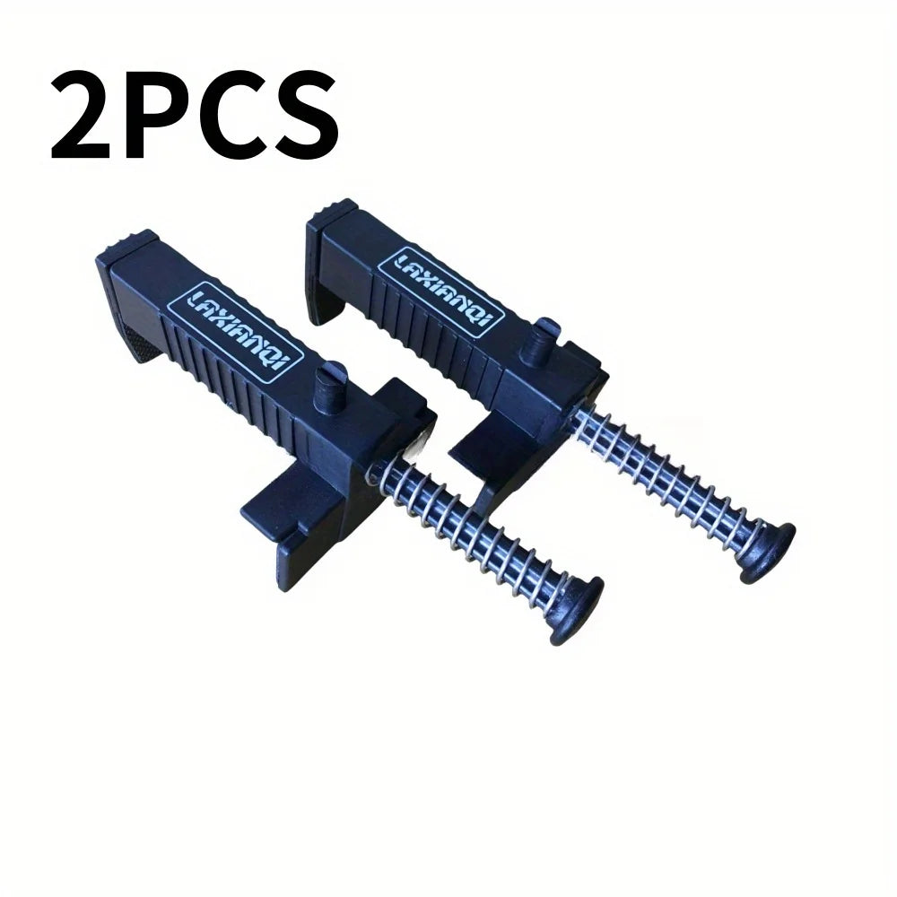 Two black precision wire clips and liners for construction