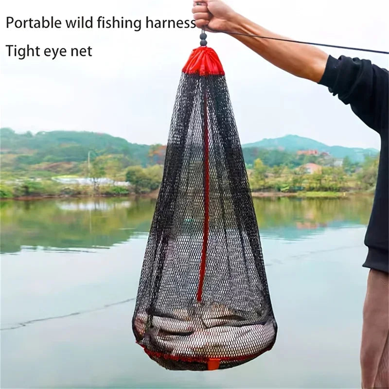 A portable wild fishing harness with a tight eye net is being held over calm water.
