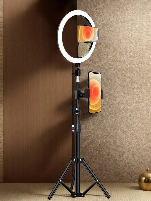 A black tripod stand holding a smartphone and a circular ring light accessory.